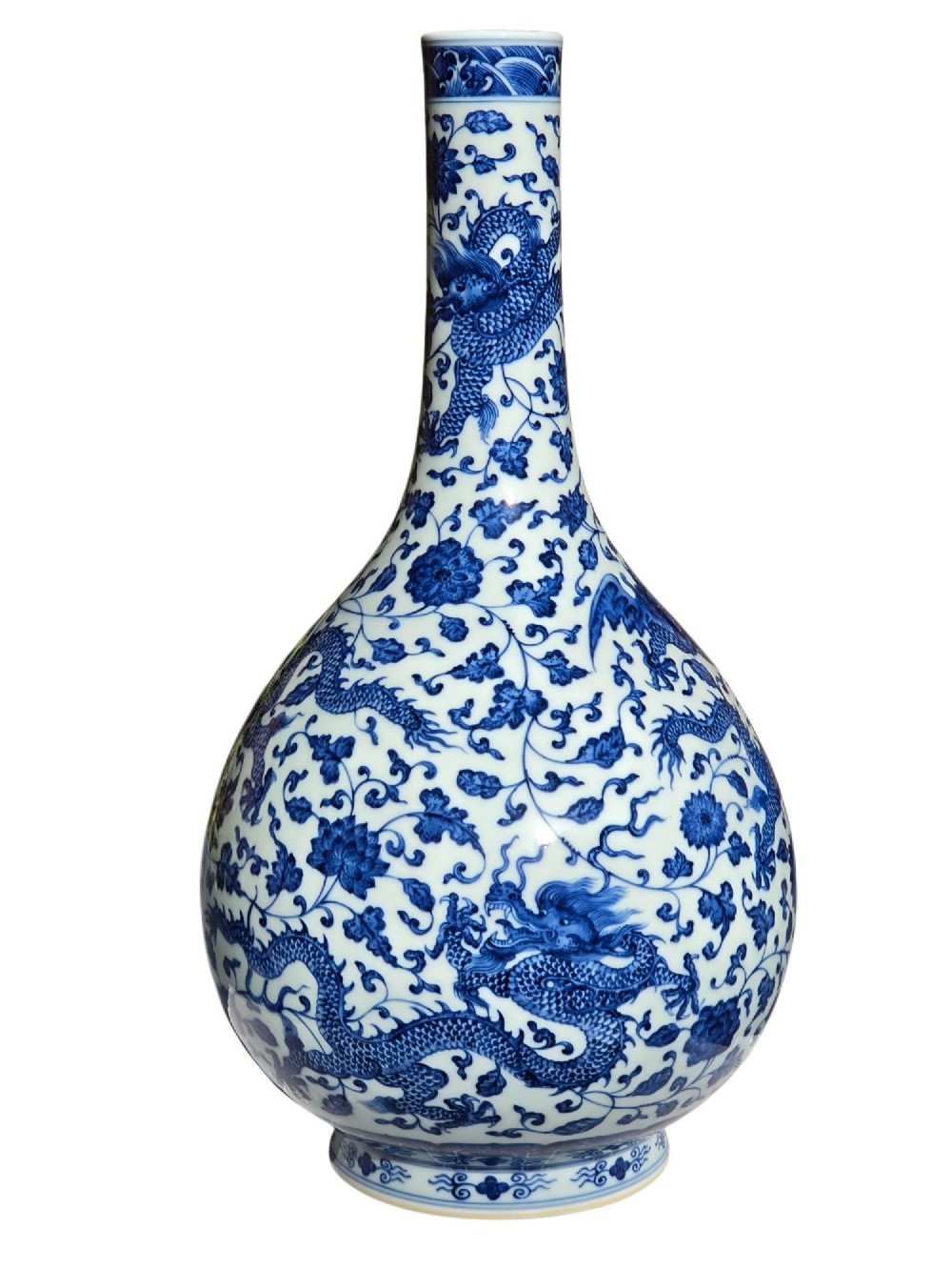 A pear-shaped Chinese porcelain bottle vase decorated with detailed underglaze cobalt blue five-clawed dragons amidst floral scrolls. View VII