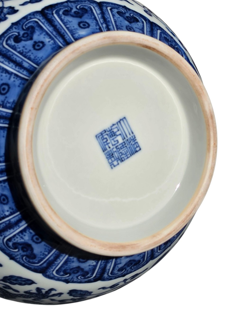 A pear-shaped Chinese porcelain bottle vase decorated with detailed underglaze cobalt blue five-clawed dragons amidst floral scrolls. View XIV