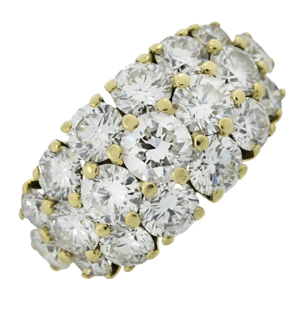 An 18ct yellow gold dome cluster ring closely set with multiple round brilliant cut diamonds in claw settings. View II