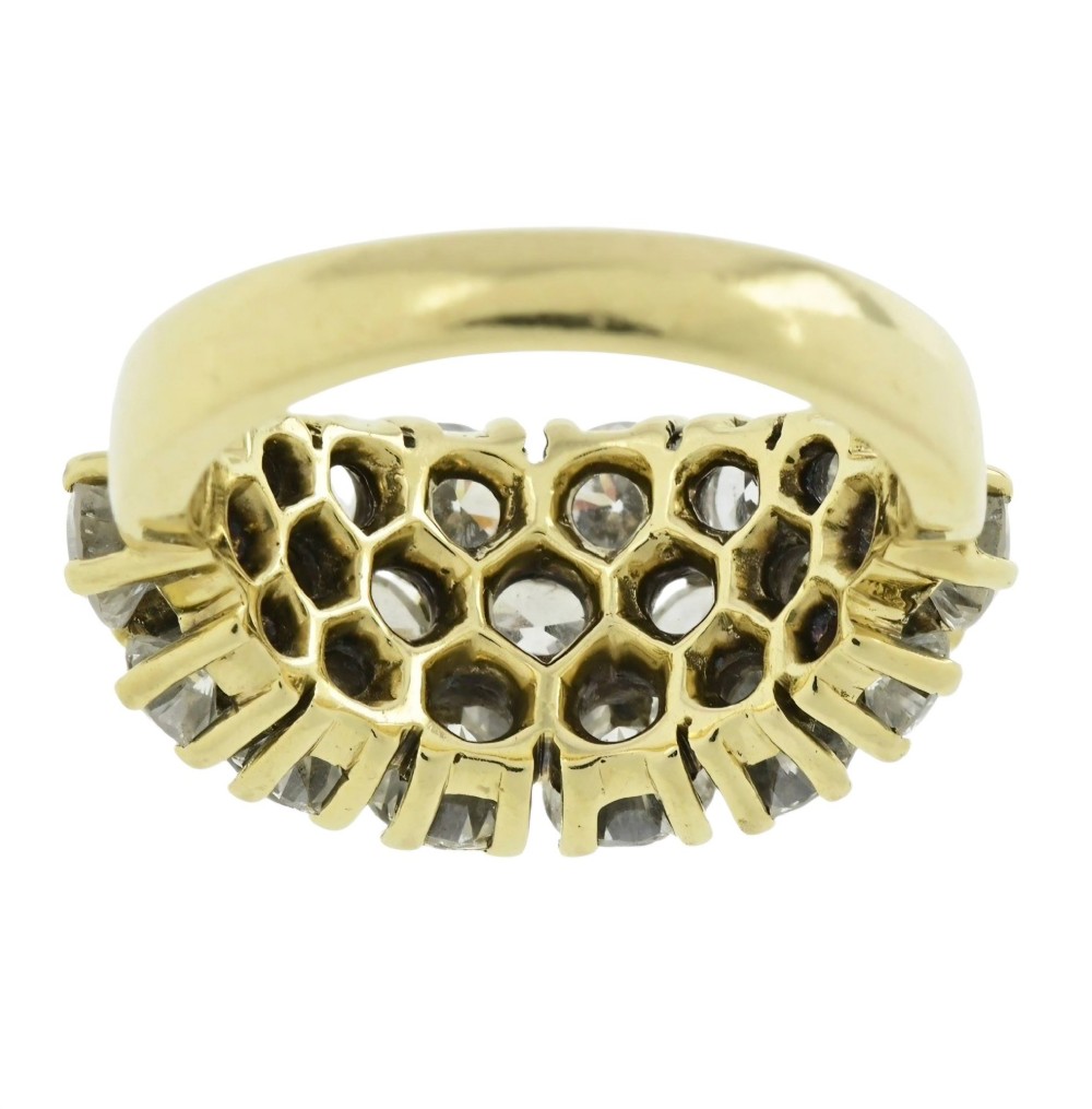 An 18ct yellow gold dome cluster ring closely set with multiple round brilliant cut diamonds in claw settings. View III