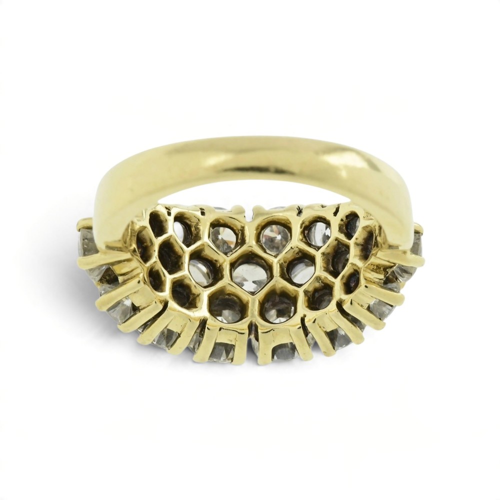 An 18ct yellow gold dome cluster ring closely set with multiple round brilliant cut diamonds in claw settings. View V