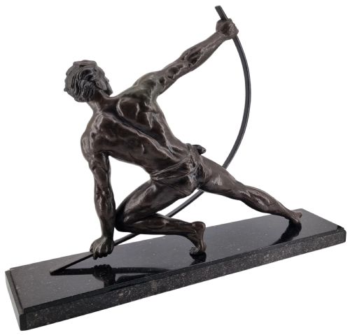 fig 2. An Art Deco dark bronze sculpture depicting a muscular male athlete bending an iron bar, mounted on a black marble plinth.