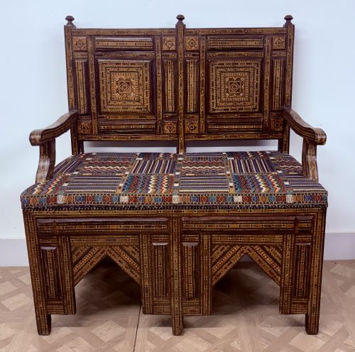 fig 2. A 19th-century double-back Syrian hardwood bench featuring intricate geometric bone and timber parquetry inlay with a patterned upholstered seat.