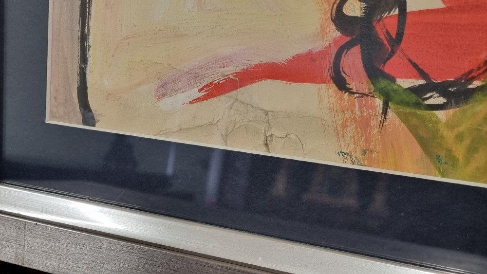 A framed 20th-century abstract mixed media painting on paper featuring energetic fluid linework, vibrant yellow, green, and red hues, set within a silver frame with a dark mount. View IV