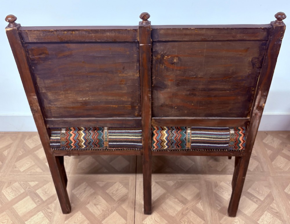 A 19th-century double-back Syrian hardwood bench featuring intricate geometric bone and timber parquetry inlay with a patterned upholstered seat. View XVII