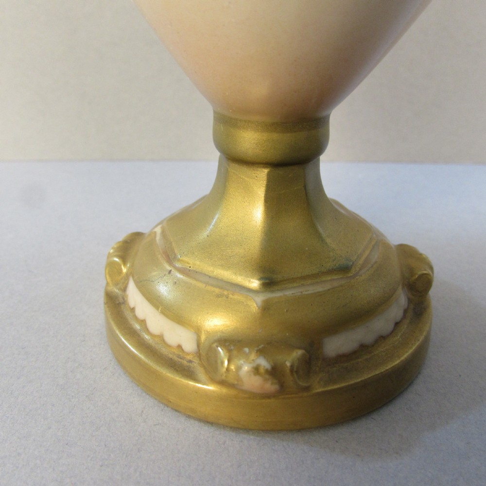 A hand-painted Royal Worcester porcelain vase featuring pink roses, twin gilded handles, and a flared neck on a pedestal base. View IV