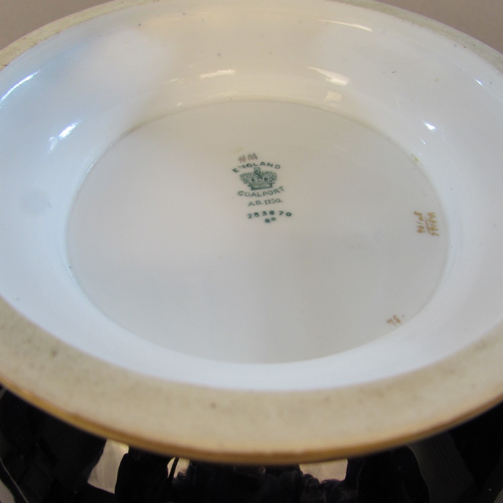 A cobalt blue porcelain jardiniere featuring gilded ram head handles, elaborate scroll gilding, and a central painted vignette of birds. View IV