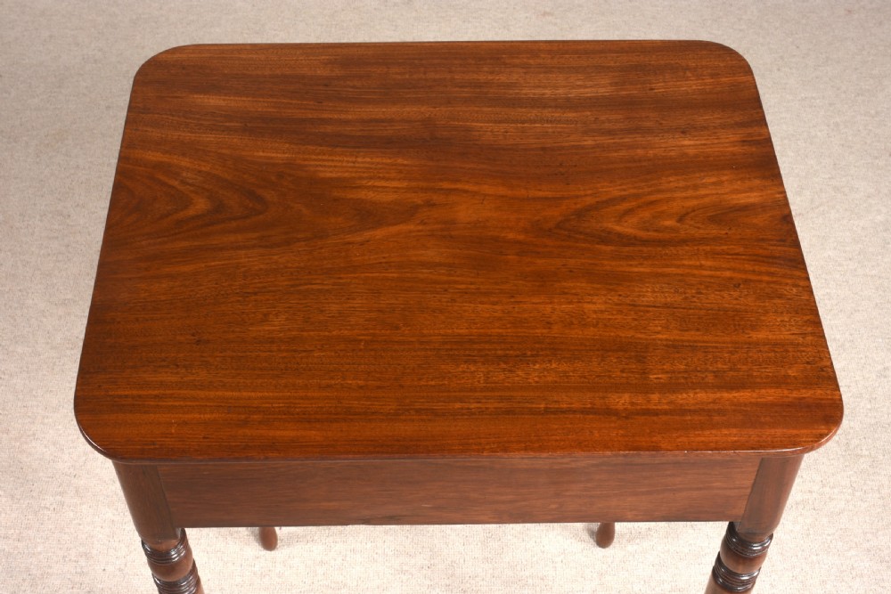 A small Regency mahogany side table featuring turned legs, a single drawer with a brass ring handle, and a square top. View IV