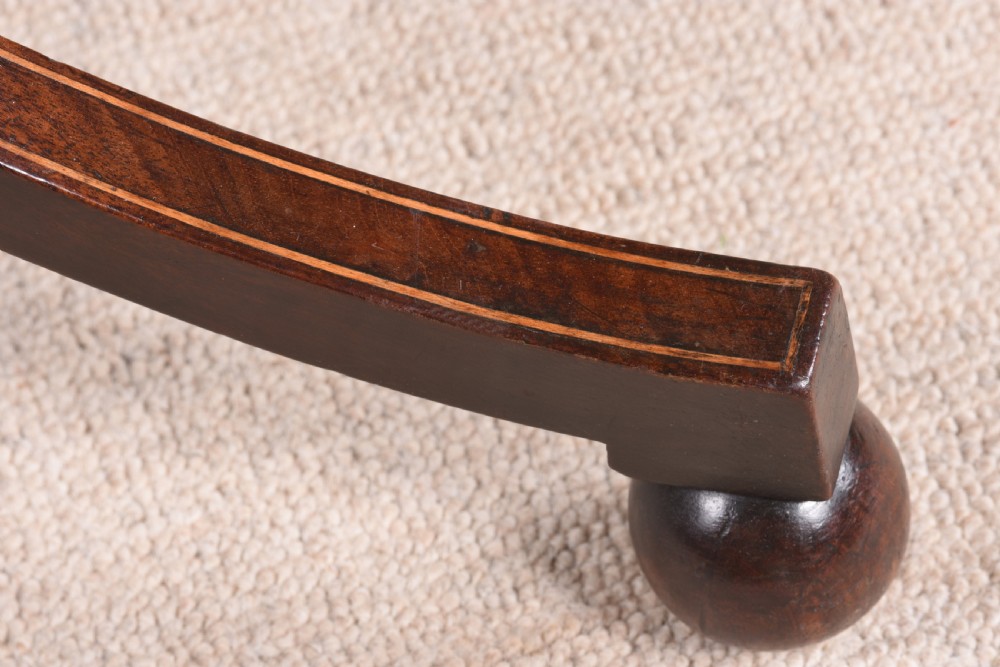 An antique mahogany tripod table featuring an octagonal top with crossbanded inlay, a spiral-twisted central pedestal, and splayed legs terminating in ball feet. View VII