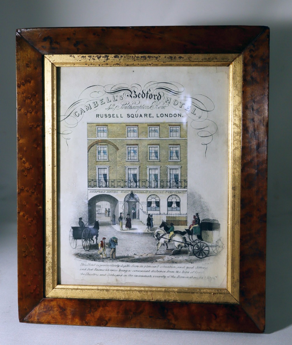 A Georgian architectural engraving depicting Cambells Bedford Hotel in London, displayed within a polished birds eye maple frame featuring a gilded inner slip.