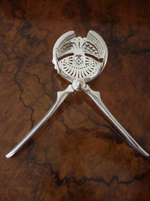 fig 1. Turn of 19th/20th centuries silver plate citrus squeezer and strainer by William Hutton and Sons.