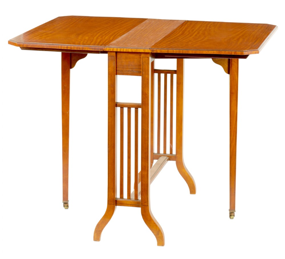 A nineteenth-century figured satinwood Sutherland table featuring two drop flaps, slatted upright legs, splayed feet, and small brass castors.