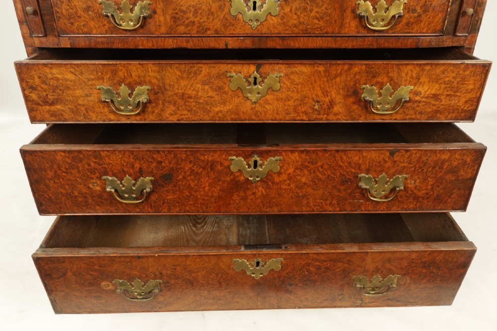 An 18th-century burr walnut bureau featuring a slant-front flap above four graduated drawers with brass handles, resting on bracket feet. View VIII