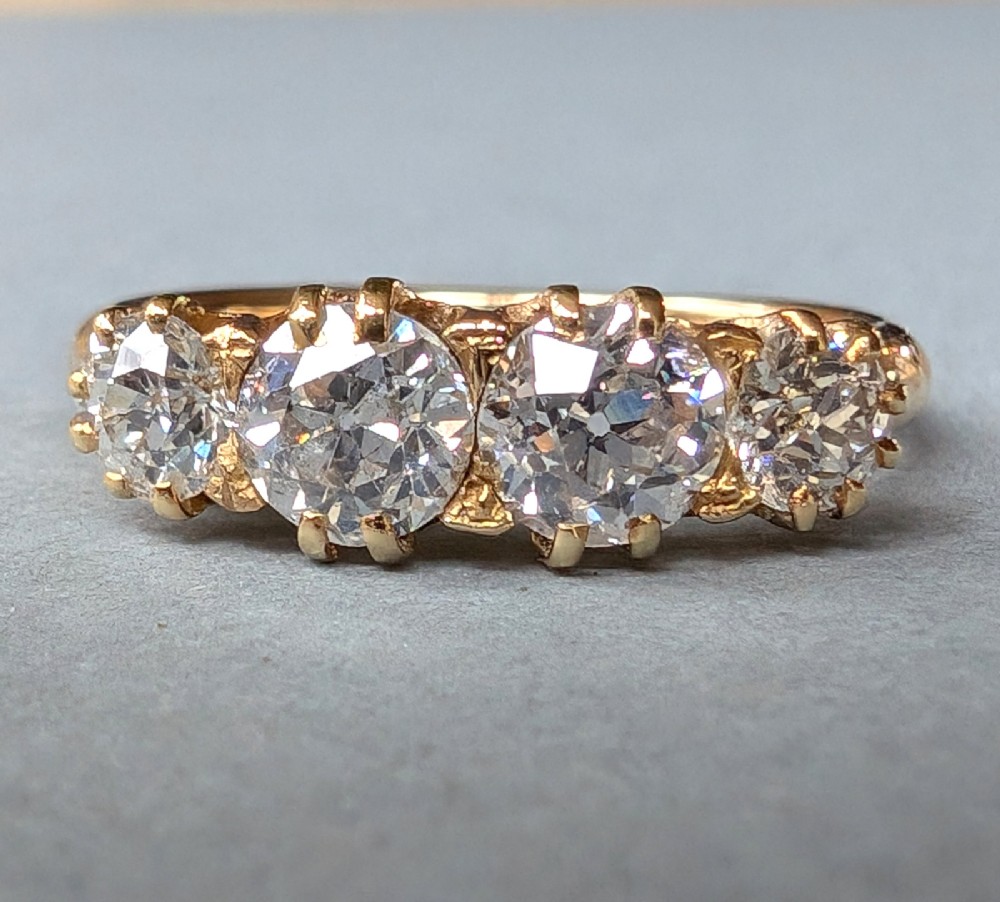 Victorian four stone 18ct gold diamond ring