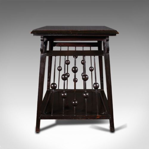 fig 2. An Aesthetic Movement ebonised wood two-tier side table featuring side galleries set with turned wooden spheres.