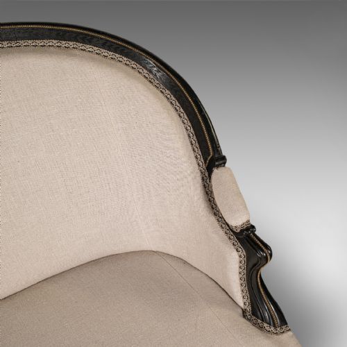 fig 6. A 19th-century Continental Louis XV style ebonised settee upholstered in neutral linen with gilt accents and cabriole legs on castors.