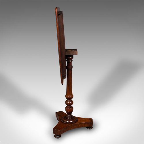 fig 3. A Regency flame mahogany tilting lamp table featuring a rectangular top, turned pedestal stem, and tri-form base.