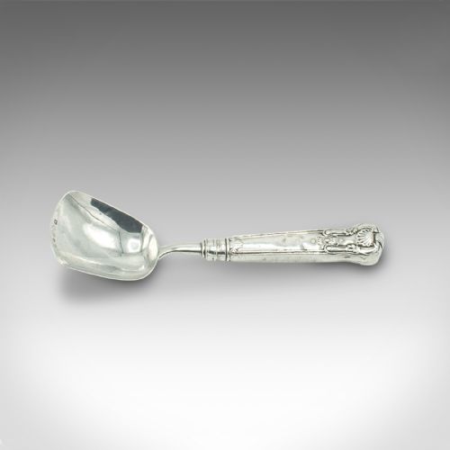 fig 1. An 18th-century English sterling silver sugar spoon featuring a square shovel-shaped bowl and a shell motif handle.