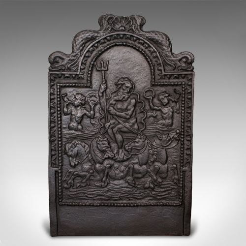 fig 1. A heavy late Victorian cast iron fireback depicting a relief scene of Neptune holding a trident on a chariot drawn by sea horses.
