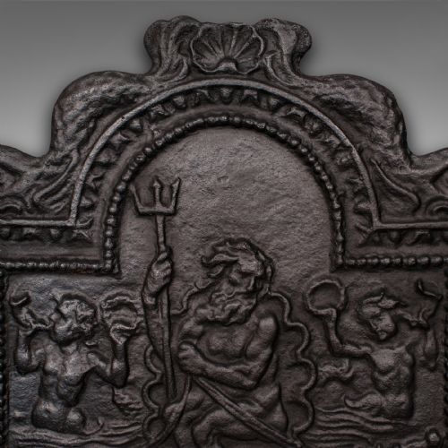 fig 3. A heavy late Victorian cast iron fireback depicting a relief scene of Neptune holding a trident on a chariot drawn by sea horses.