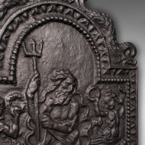 fig 4. A heavy late Victorian cast iron fireback depicting a relief scene of Neptune holding a trident on a chariot drawn by sea horses.