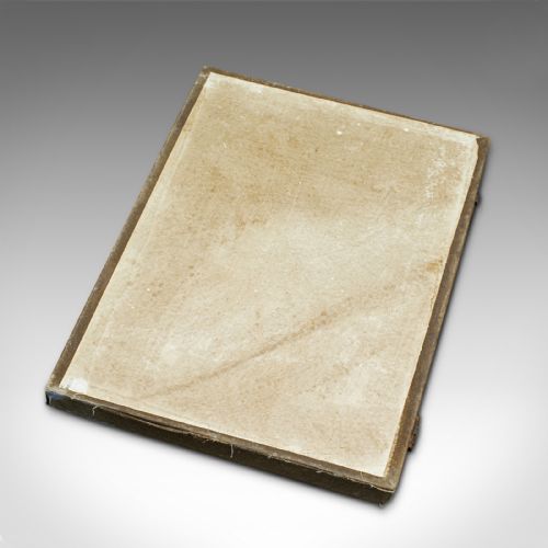 fig 4. An eight-piece set of black Japanese calligraphic ink blocks in various geometric and organic shapes with gold detailed relief, alongside a patterned storage box.