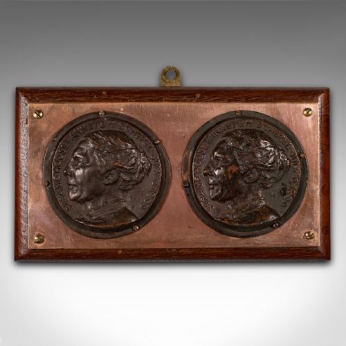 fig 1. A late Victorian mounted portrait plaque featuring two circular bronze profile medallions set on a copper plate with a mahogany timber mount.