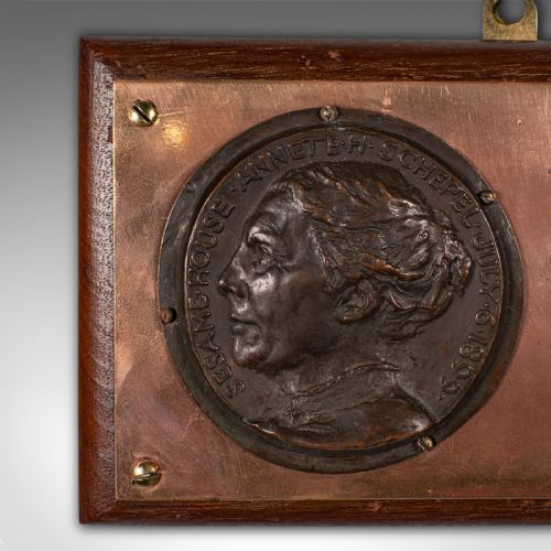 fig 3. A late Victorian mounted portrait plaque featuring two circular bronze profile medallions set on a copper plate with a mahogany timber mount.