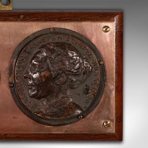 fig 4. A late Victorian mounted portrait plaque featuring two circular bronze profile medallions set on a copper plate with a mahogany timber mount.