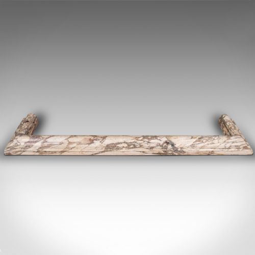 fig 1. A three-sided Georgian marble fireplace fender featuring heavily veined cream and grey stone with moulded upper edges.