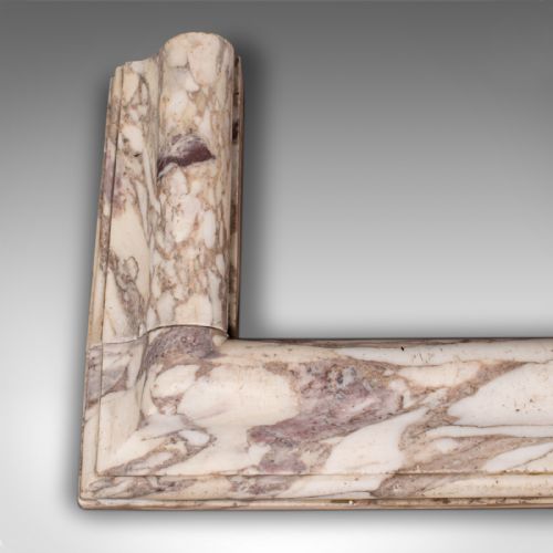 fig 2. A three-sided Georgian marble fireplace fender featuring heavily veined cream and grey stone with moulded upper edges.