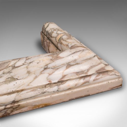 fig 4. A three-sided Georgian marble fireplace fender featuring heavily veined cream and grey stone with moulded upper edges.