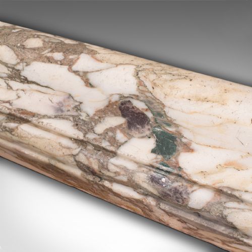 fig 5. A three-sided Georgian marble fireplace fender featuring heavily veined cream and grey stone with moulded upper edges.