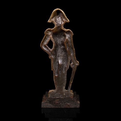 fig 2. A late Georgian brass figural doorstop depicting Admiral Lord Nelson standing in military attire upon a dark stepped base.