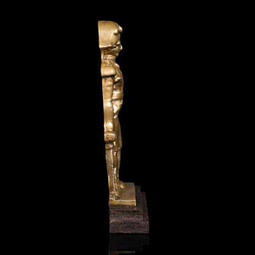 fig 3. A late Georgian brass figural doorstop depicting Admiral Lord Nelson standing in military attire upon a dark stepped base.
