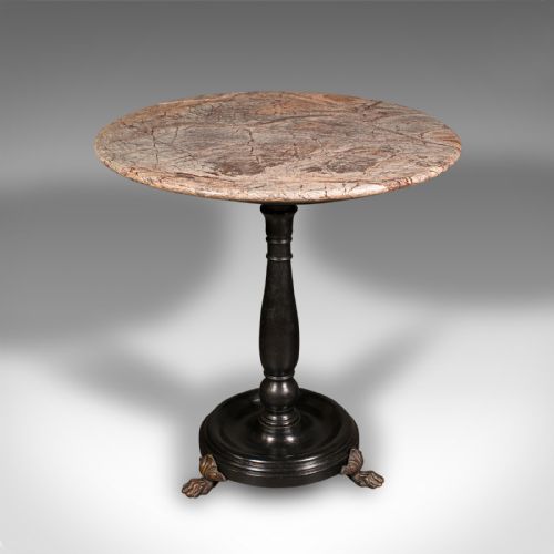fig 1. A circular veined marble top resting upon a dark turned wooden pedestal stem with a round plinth base and three brass claw feet.