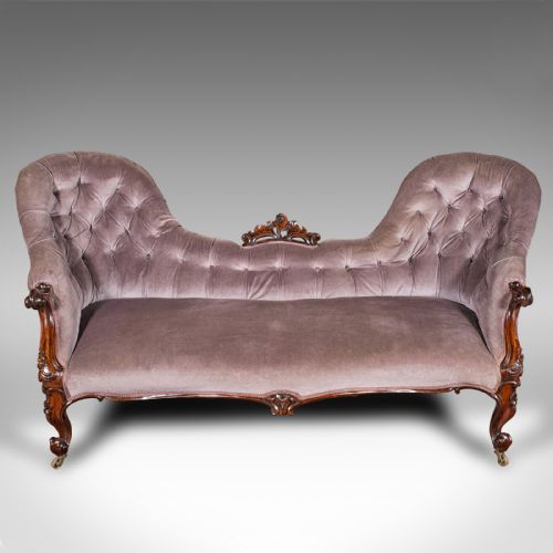 fig 1. An early Victorian double spoon back settee upholstered in mauve velvet with a carved timber frame and cabriole legs.