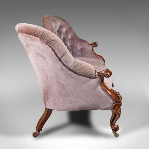 fig 2. An early Victorian double spoon back settee upholstered in mauve velvet with a carved timber frame and cabriole legs.