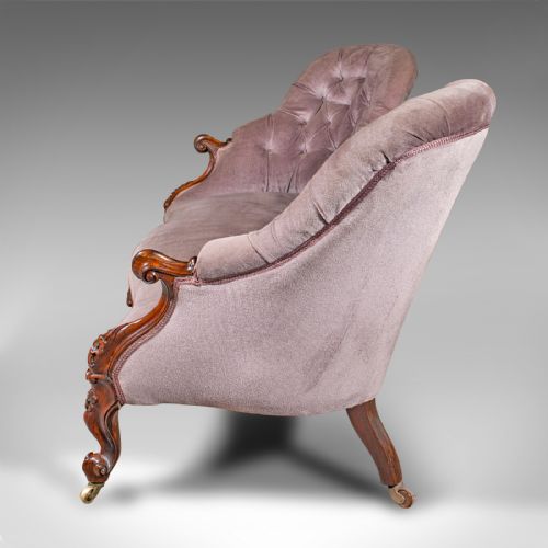 fig 3. An early Victorian double spoon back settee upholstered in mauve velvet with a carved timber frame and cabriole legs.