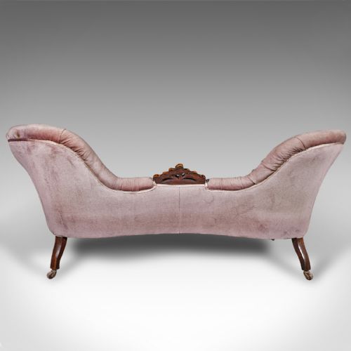 fig 4. An early Victorian double spoon back settee upholstered in mauve velvet with a carved timber frame and cabriole legs.