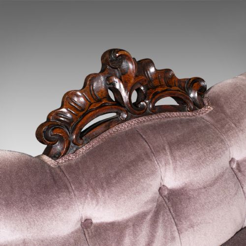 fig 6. An early Victorian double spoon back settee upholstered in mauve velvet with a carved timber frame and cabriole legs.