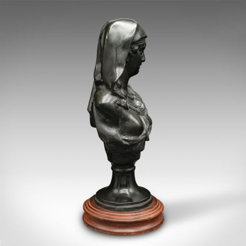 fig 3. A dark patinated French bronze portrait bust of a veiled woman wearing detailed drapery, set on a turned wooden base.