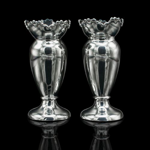 fig 1. A pair of Edwardian hallmarked silver duck egg cups featuring crimped rims and pedestal bases.