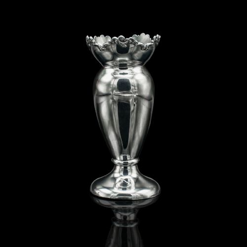 fig 2. A pair of Edwardian hallmarked silver duck egg cups featuring crimped rims and pedestal bases.