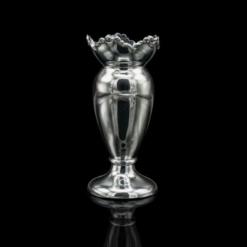 fig 3. A pair of Edwardian hallmarked silver duck egg cups featuring crimped rims and pedestal bases.