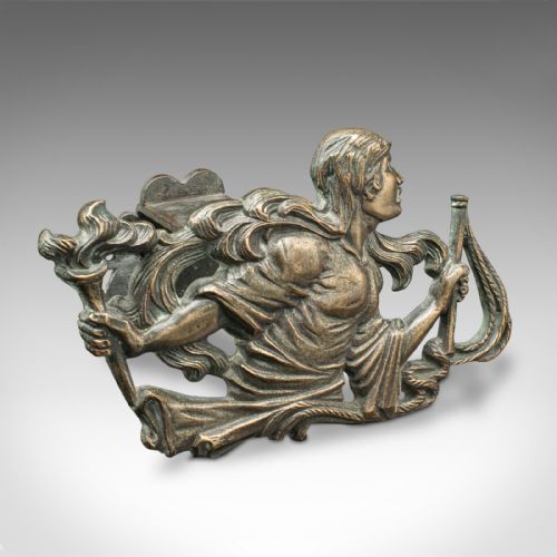 fig 2. A pair of mid-19th century French bronze figural andirons featuring sculpted classical figures holding torches with iron hearth supports behind.
