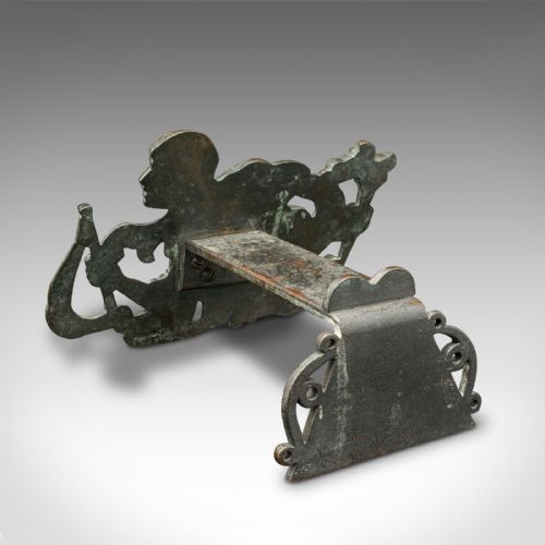 fig 3. A pair of mid-19th century French bronze figural andirons featuring sculpted classical figures holding torches with iron hearth supports behind.