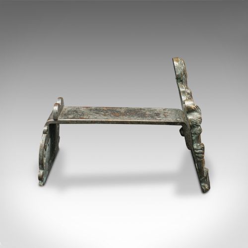 fig 4. A pair of mid-19th century French bronze figural andirons featuring sculpted classical figures holding torches with iron hearth supports behind.