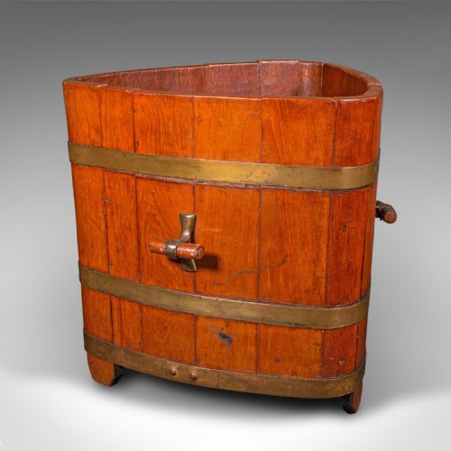 fig 2. An Early Victorian triangular wooden fireside bin constructed with staves bound by brass bands and side carrying handles.