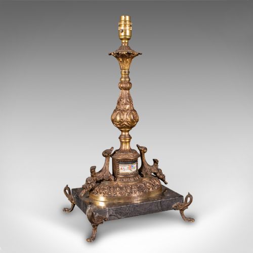 fig 2. A pair of ornate French gilt metal table lamp bases mounted on black veined marble plinths with scrolled feet.
